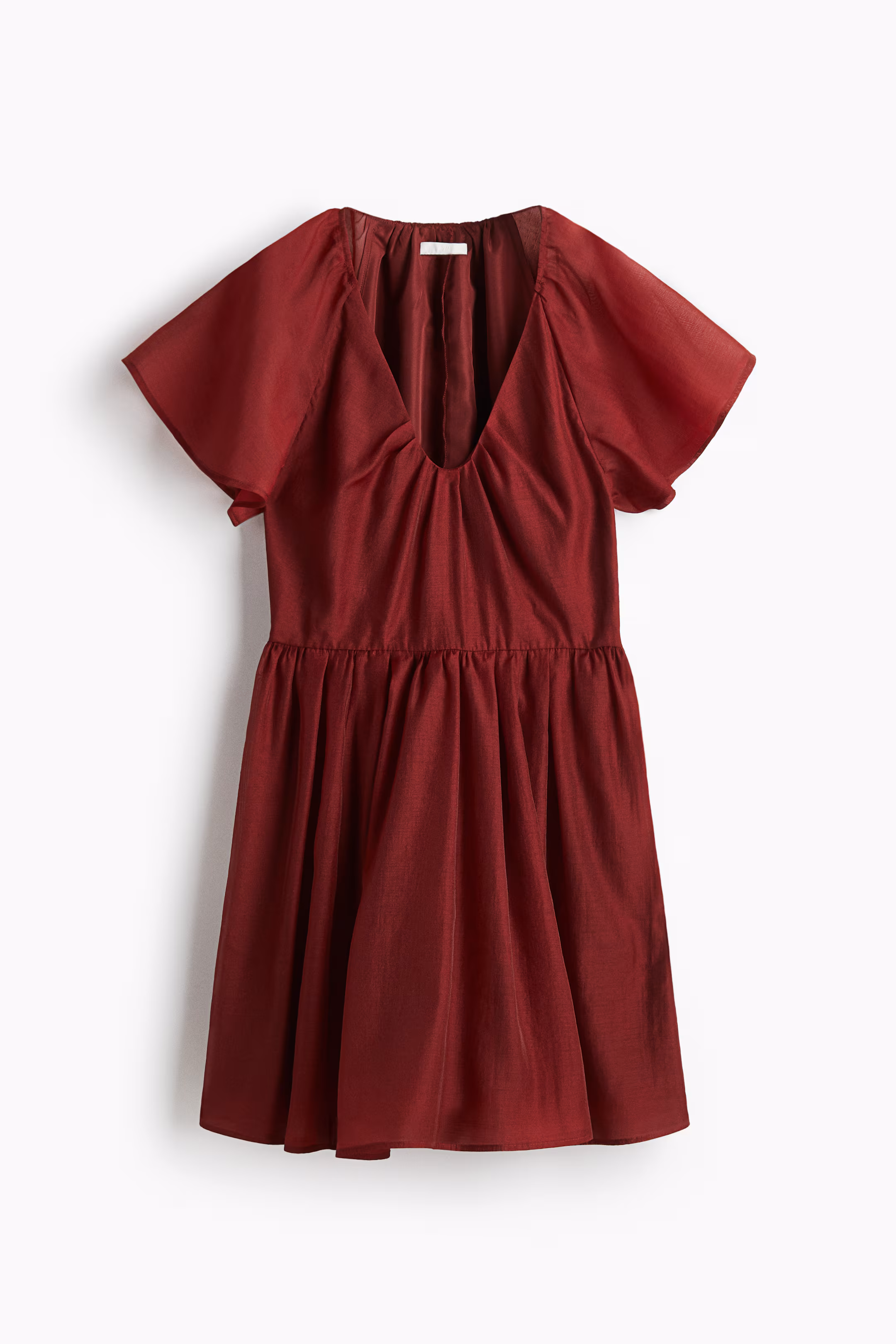 Le secret des manches : flatter le haut du corps sans en faire trop